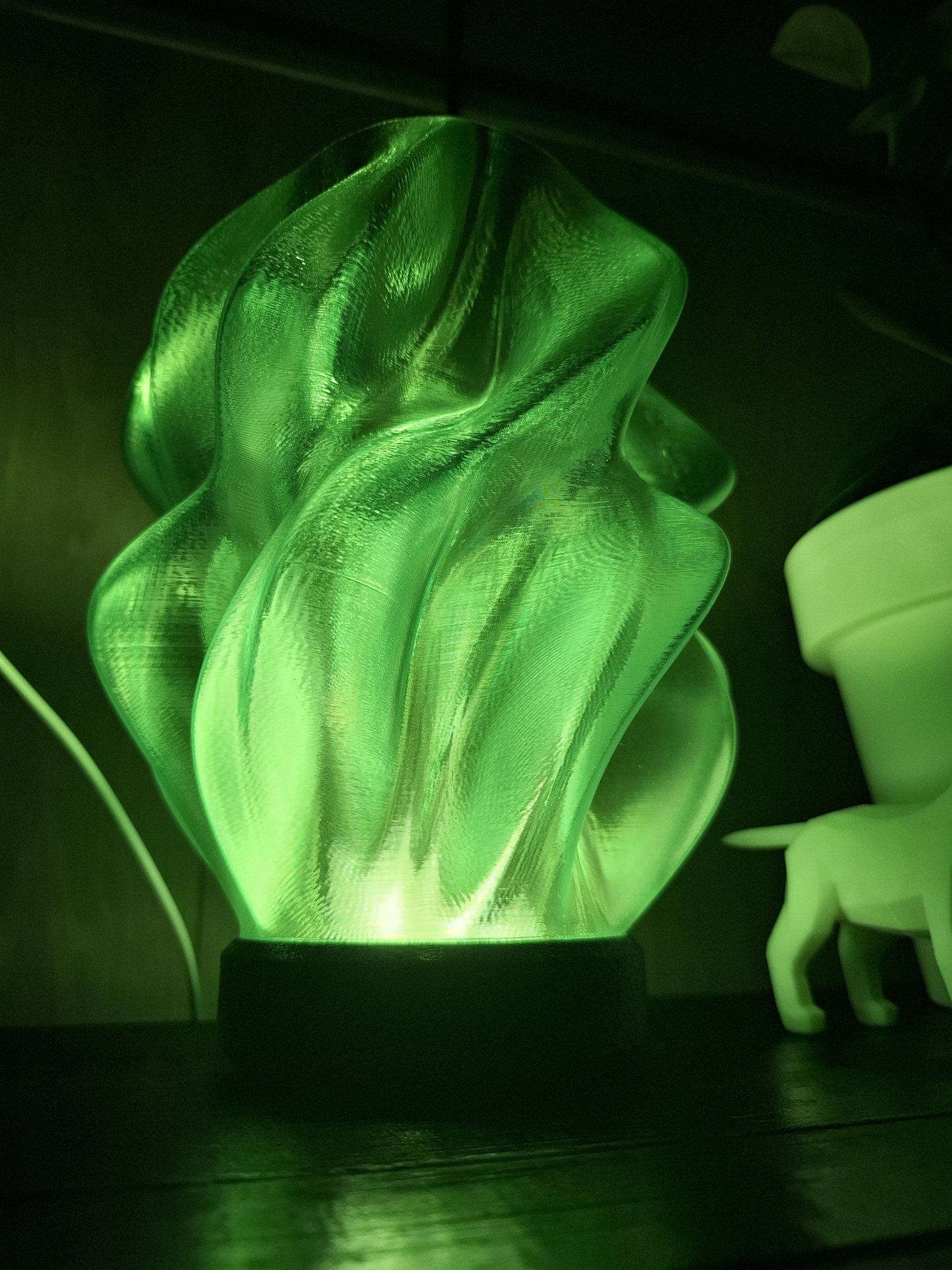 The Ember lamp glowing green, 3D printed by C-Kustoms